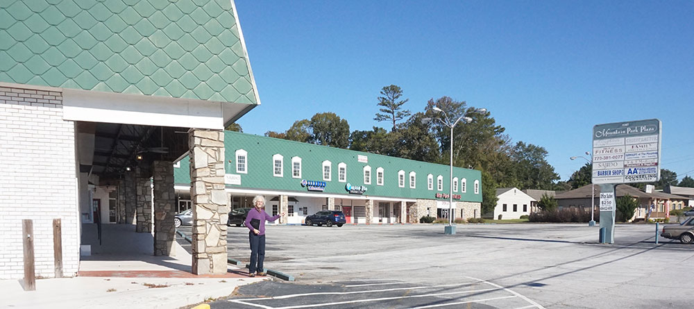 Ms. Pittman is shown at the Mountain Park Plaza on Five Forks Trickum, one of the first shopping centers in the area.