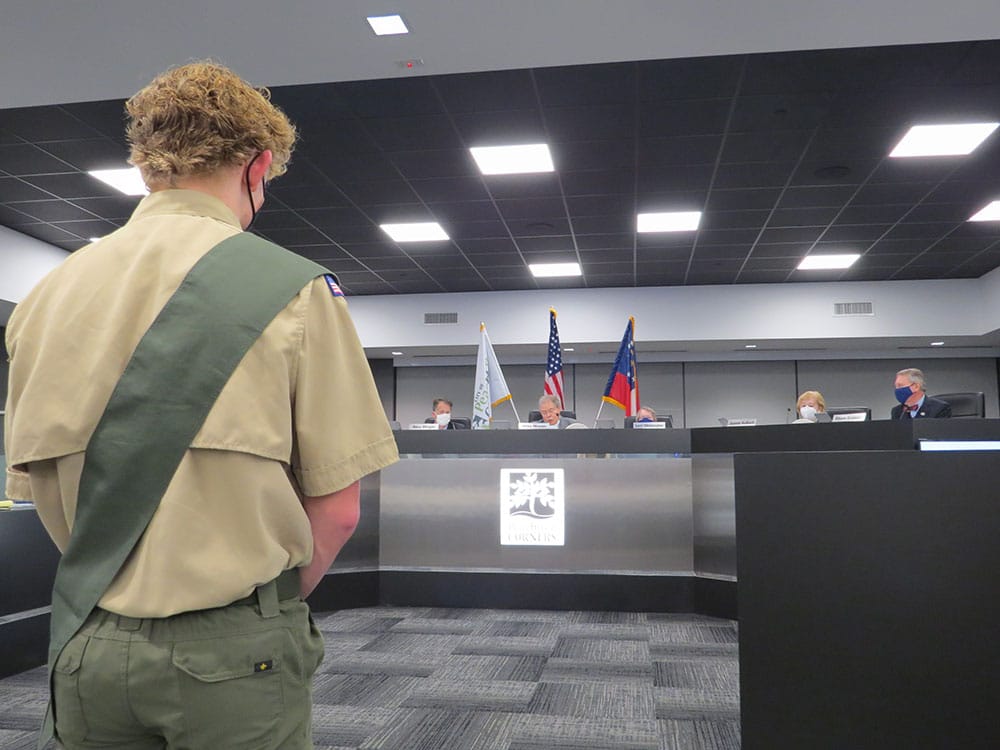 Wesleyan student, Paul Nichols, stands before the council as Mayor Mason reads the proclamation recognizing his achievement of earning Boy Scouts highest honor, Eagle Scout.