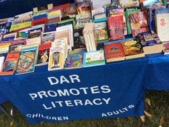 Philadelphia Winn sponsored a “free books” booth at the Elisha Winn Fair in Dacula in support of its literacy promotion mission. Books for all ages were available with no limit to the number of books taken. Over 800 gently used books were donated by members.