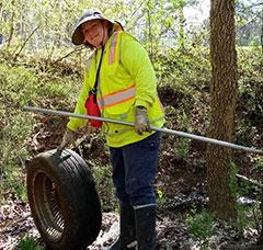 Donna Swessel has her own work to do with tire cleanup.