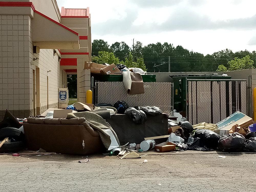 Illegal dumping in the parking lot of a retail business on Centerville Highway in unincorporated Gwinnett County can be quite an eyesore.