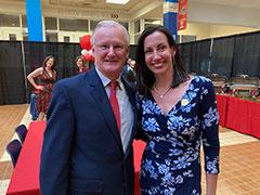 Mrs. Simpkins, shown with her college cross country coach, Andy Ronan, was inducted into the Stony Brook University (New York) Sports Hall of Fame last year, as she became the first NCAA Division 1 All-American in any sport at the university.  