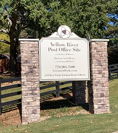 Sign shows that the restored Yellow River Post Office near Lilburn was built around 1840.  The park is open to the public seven days a week during daylight hours. (Gwinnett Citizen Photos by Lanie Lessard-Cox)