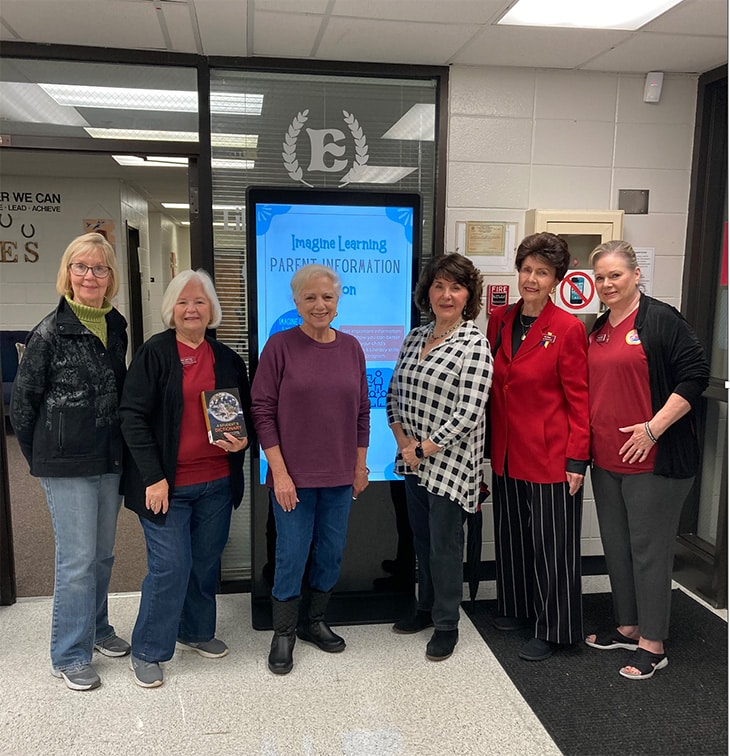 Lilburn Woman’s Club members Karen Snavely, Kathy Mattox, Pat Shaver, Gloria Sill, Pat Otwell and Charleen Ray pose at Lilburn Elementary school after donating dictionaries to all third-grade students.